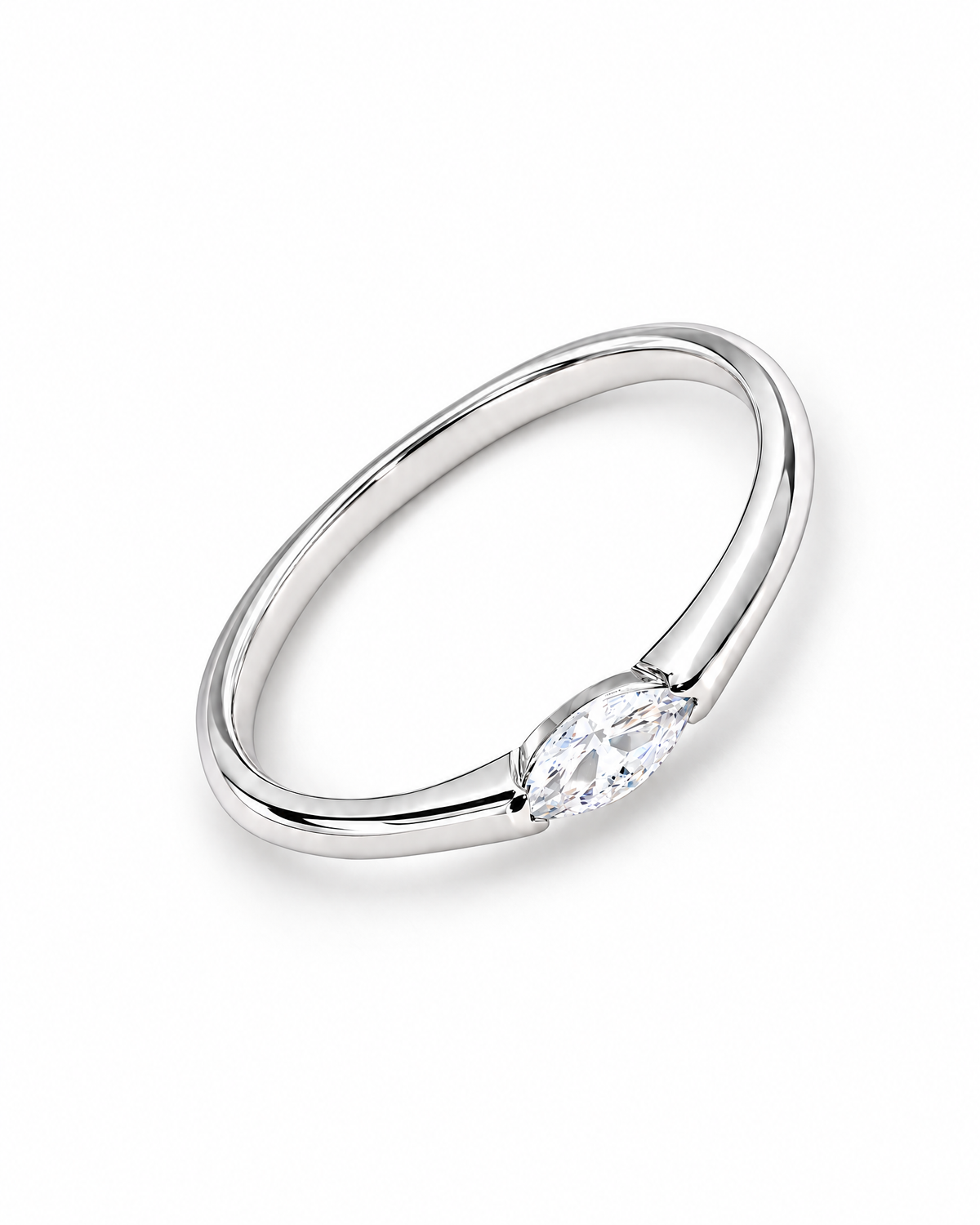 The Aure Marquise-Cut CZ Ring, polished silver overhead diagonal resting-lay view on a pearl-white studio background — reference-based AI visualization.