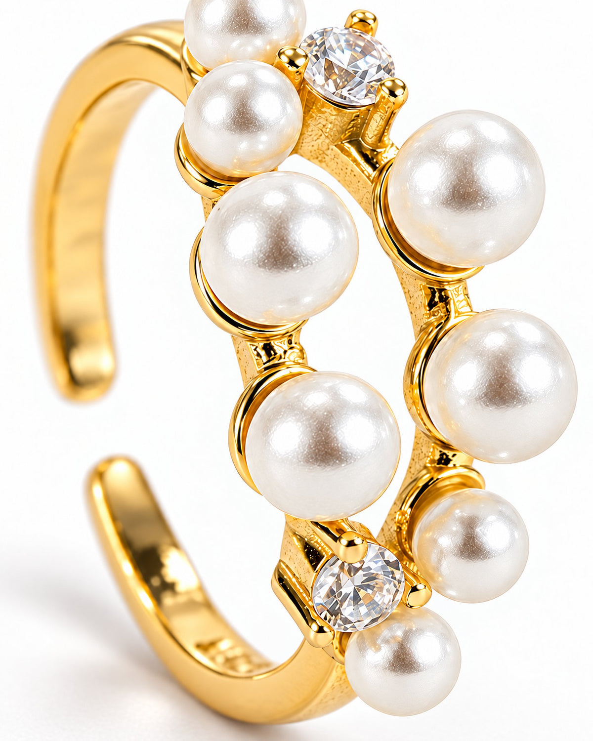 The Ilse Pearl Cluster Ring in observed gold finish, close macro view of ivory pearl-like cabochons, clear round faceted accents, and petite gold prong settings on a pearl-white background; reference-based AI visualization.