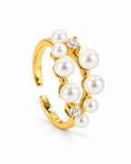 The Ilse Pearl Cluster Ring in observed gold finish, product-only front three-quarter full-ring studio view on a pearl-white background; reference-based AI visualization.