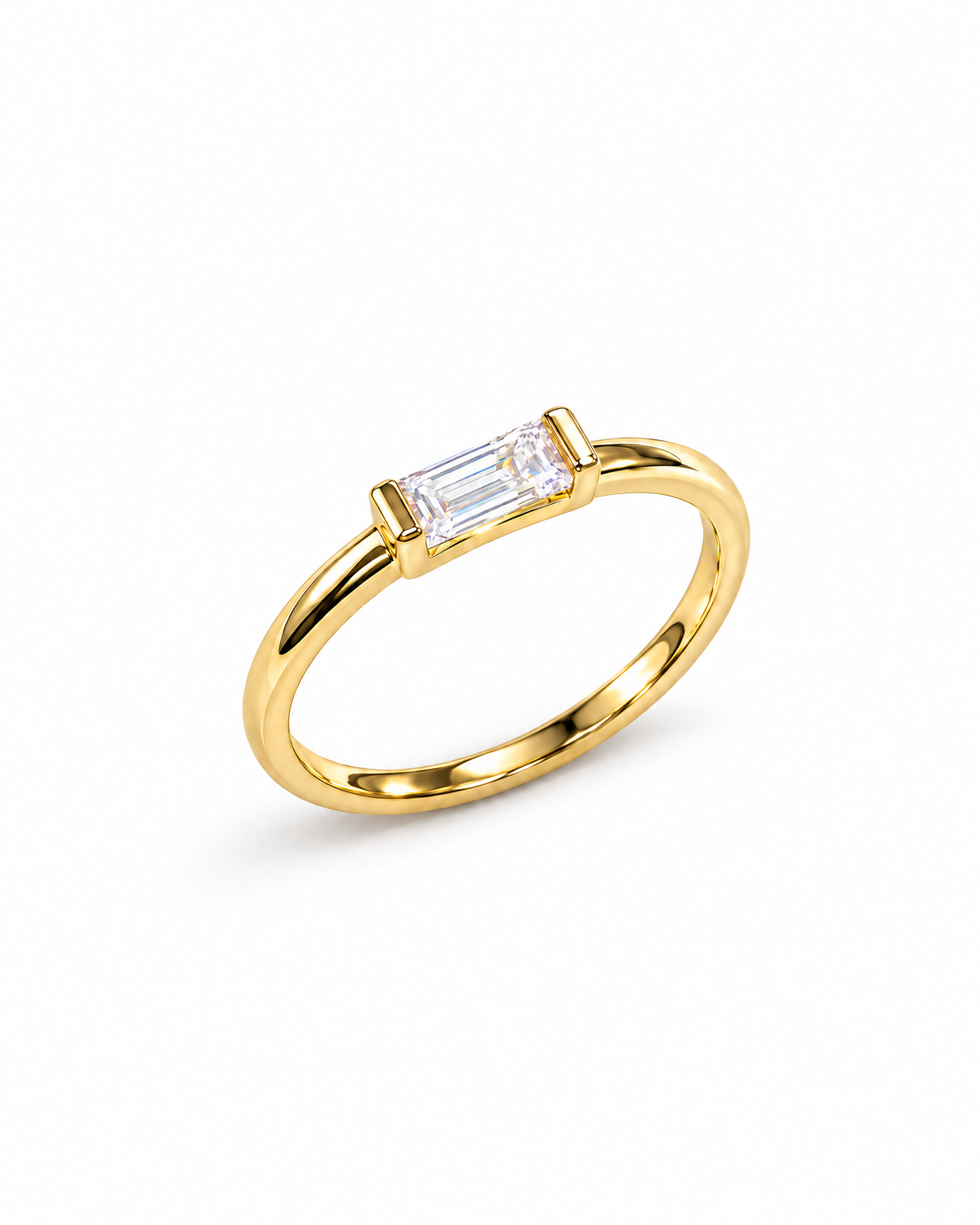 The Lyra CZ Emerald-Cut Statement Ring — gold-color complete diagonal product view with a clear emerald-cut center stone on a pearl-white studio background; reference-based AI visualization.