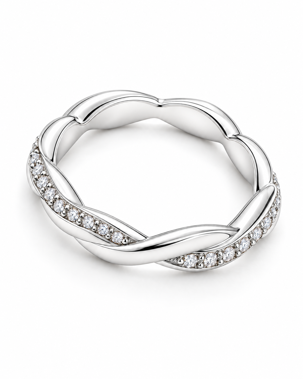 The Veda CZ Twisted Band — polished silver twisted band with clear round CZ accents, face-up resting full-ring view on pearl-white studio background; reference-based AI visualization.