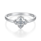 Unedited original supplier reference photograph of The Seren Quatrefoil Moissanite Ring with its inner-band mark visible.