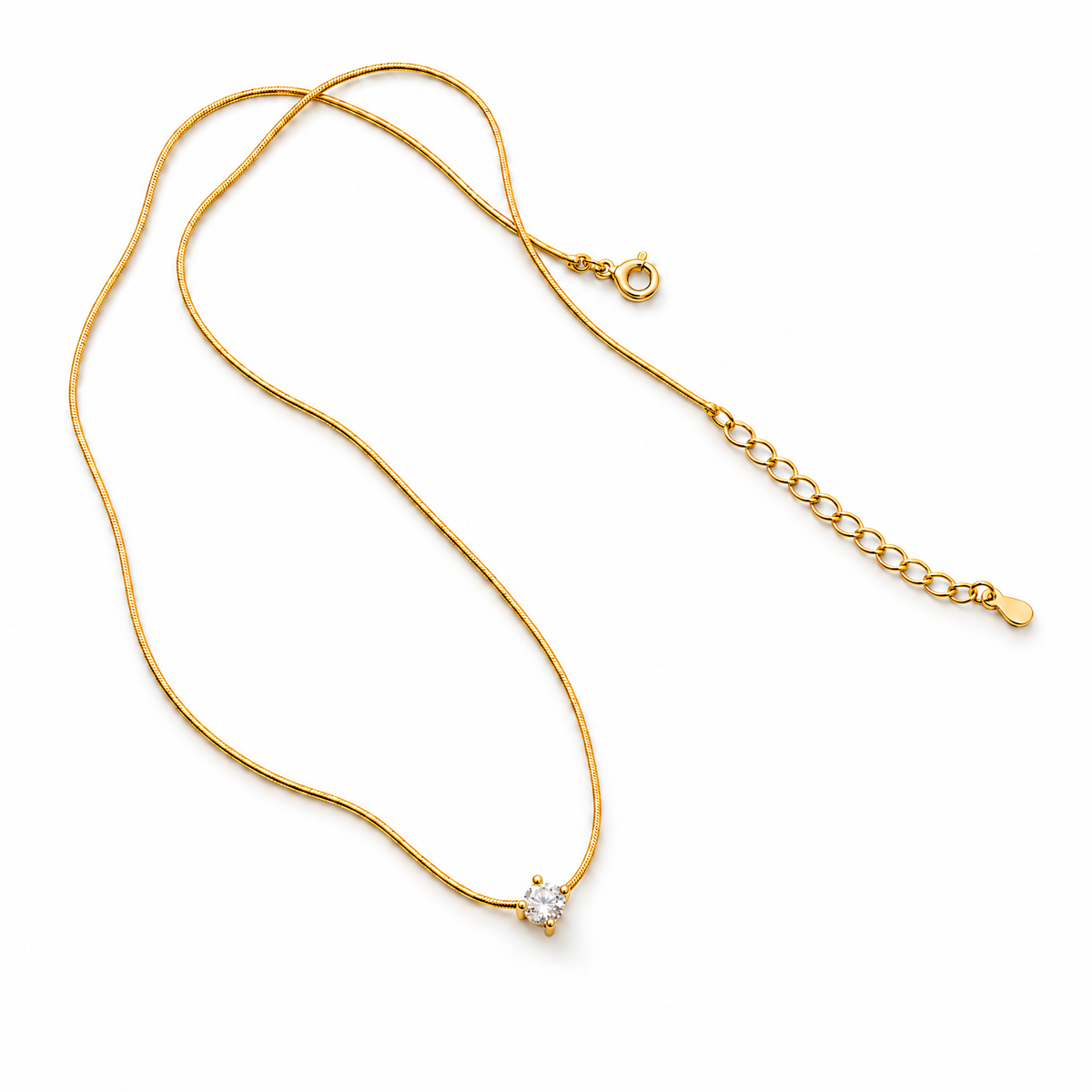 The Elora CZ Pendant — full chain and closure flat lay in a white studio; reference-based AI visualization.
