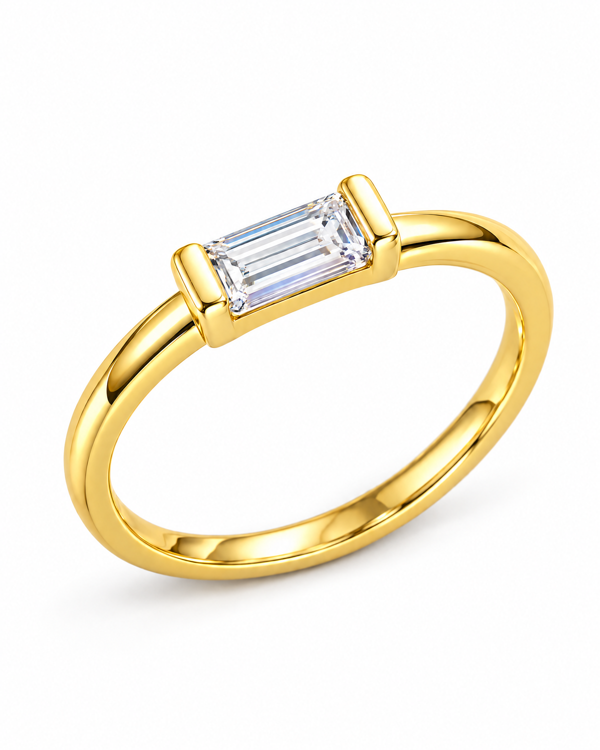 The Lyra CZ Emerald-Cut Statement Ring — gold-color closer emerald-cut center and end-bar-prong detail on a pearl-white studio background; reference-based AI visualization.