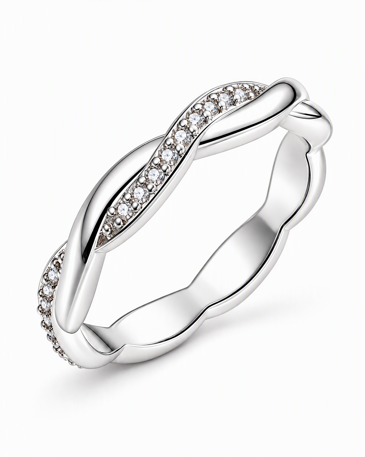 The Veda CZ Twisted Band — polished silver twisted band with clear round CZ accents, front three-quarter product-only hero on pearl-white studio background; reference-based AI visualization.