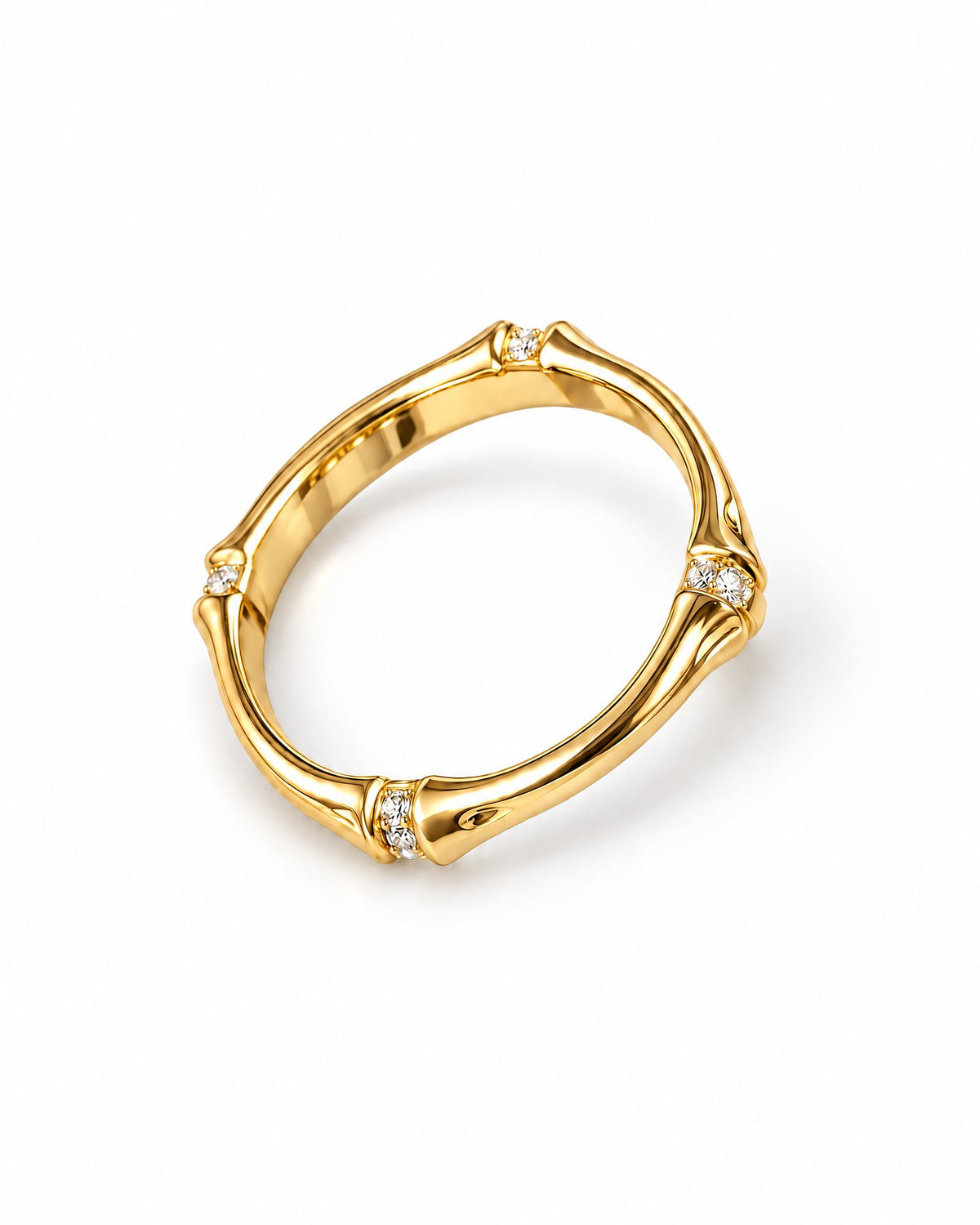 The Ebba Bamboo Band in polished yellow-gold color with clear round stone accents, product-only elevated front three-quarter studio view on a pearl-white background; reference-based AI visualization.