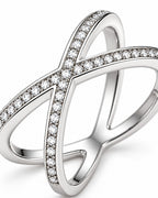 The Elsen Geometric Ring in a polished silver-tone finish with clear round stones, close crossover-setting macro detail on a pearl-white studio background, reference-based AI visualization