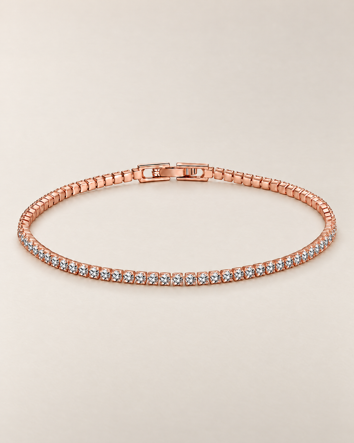 The Mila Tennis Bracelet in Rose Gold Tone, shown as a full oval with clear stones and a closed clasp on a warm pale-greige studio background, reference-based AI visualization.