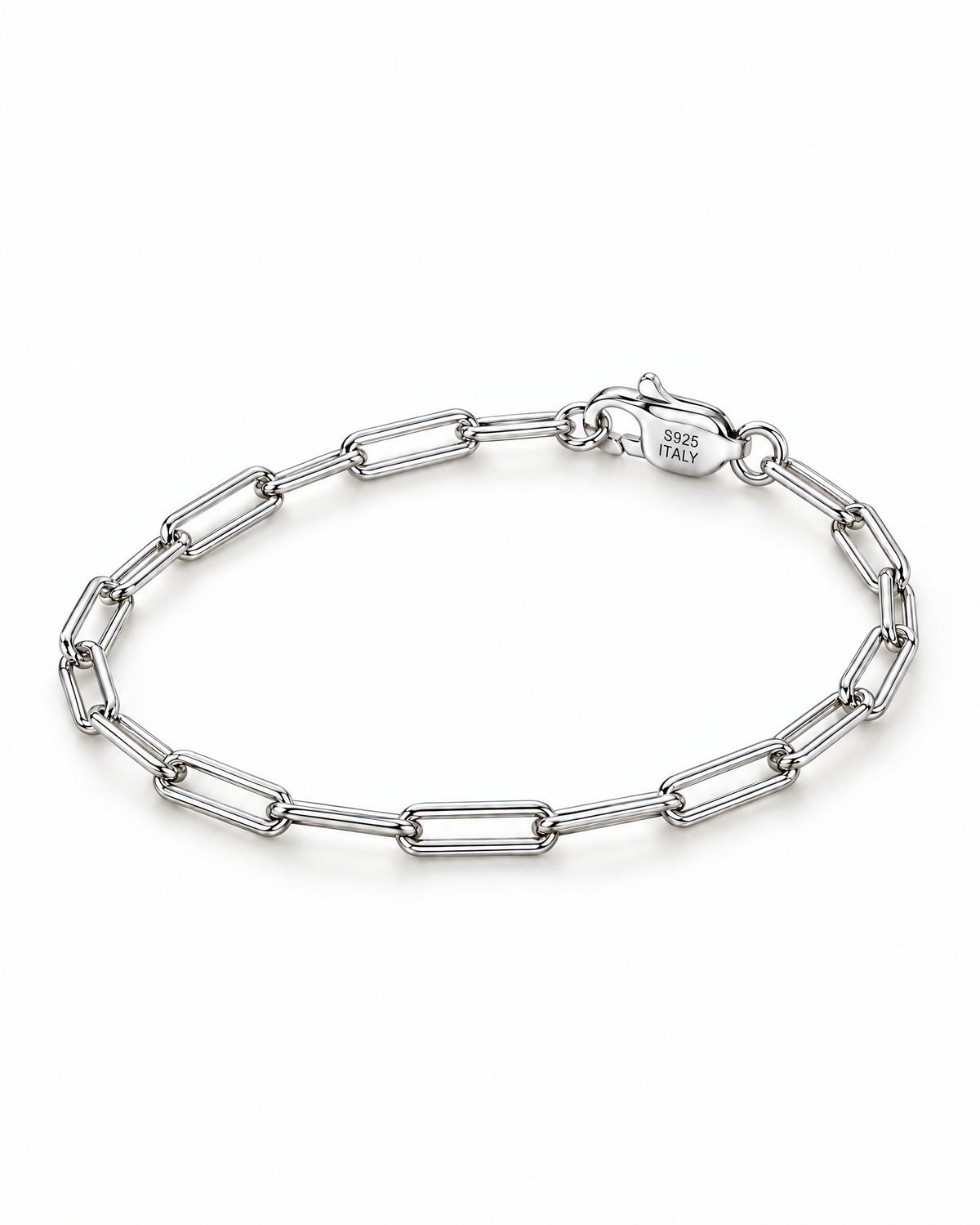 The Aelin Paperclip Bracelet in polished silver tone, complete oval resting lay with the marked clasp toward the upper-right on a plain pearl-white studio surface; reference-based AI visualization