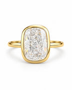 The Tilde Bezel Ring in polished yellow-gold tone with one clear faceted rounded-rectangle stone in an upright product-only pearl-white studio hero — reference-based AI visualization