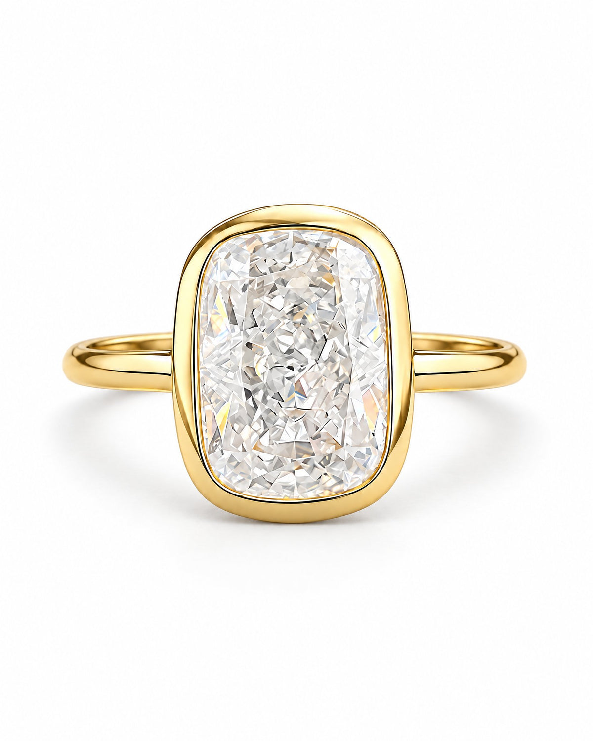 The Tilde Bezel Ring in polished yellow-gold tone with one clear faceted rounded-rectangle stone in an upright product-only pearl-white studio hero — reference-based AI visualization