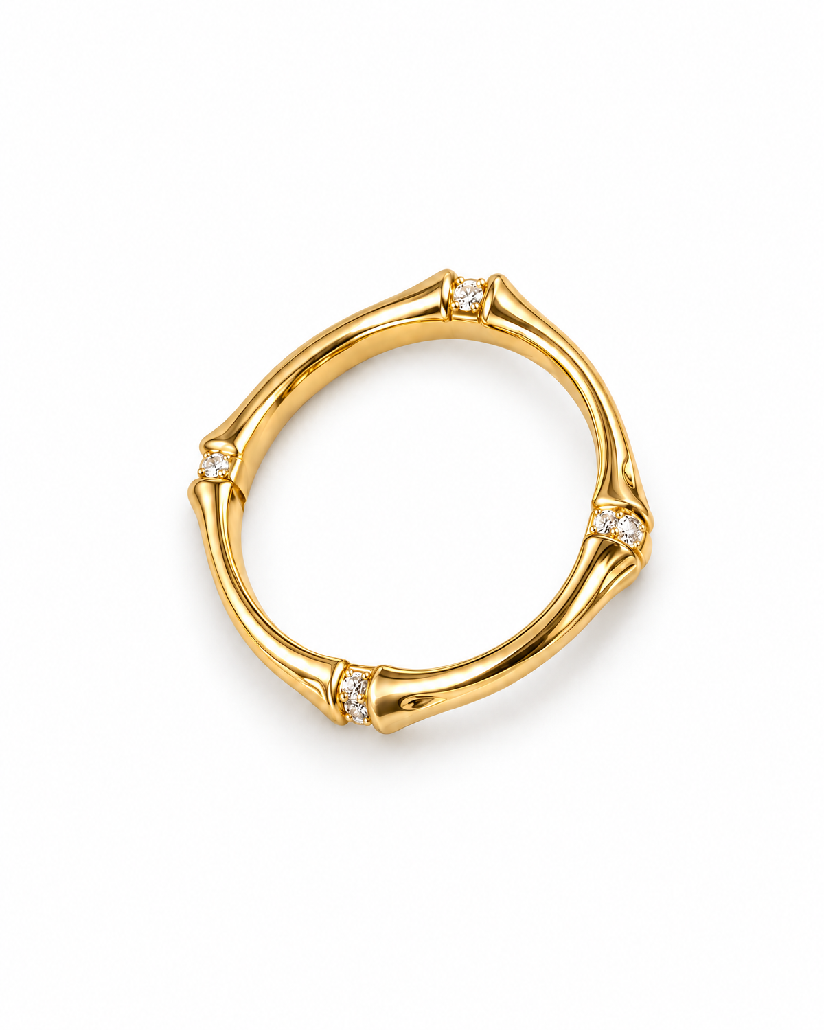 The Ebba Bamboo Band in polished yellow-gold color with clear round stone accents, overhead product-only studio view on a pearl-white background; reference-based AI visualization.