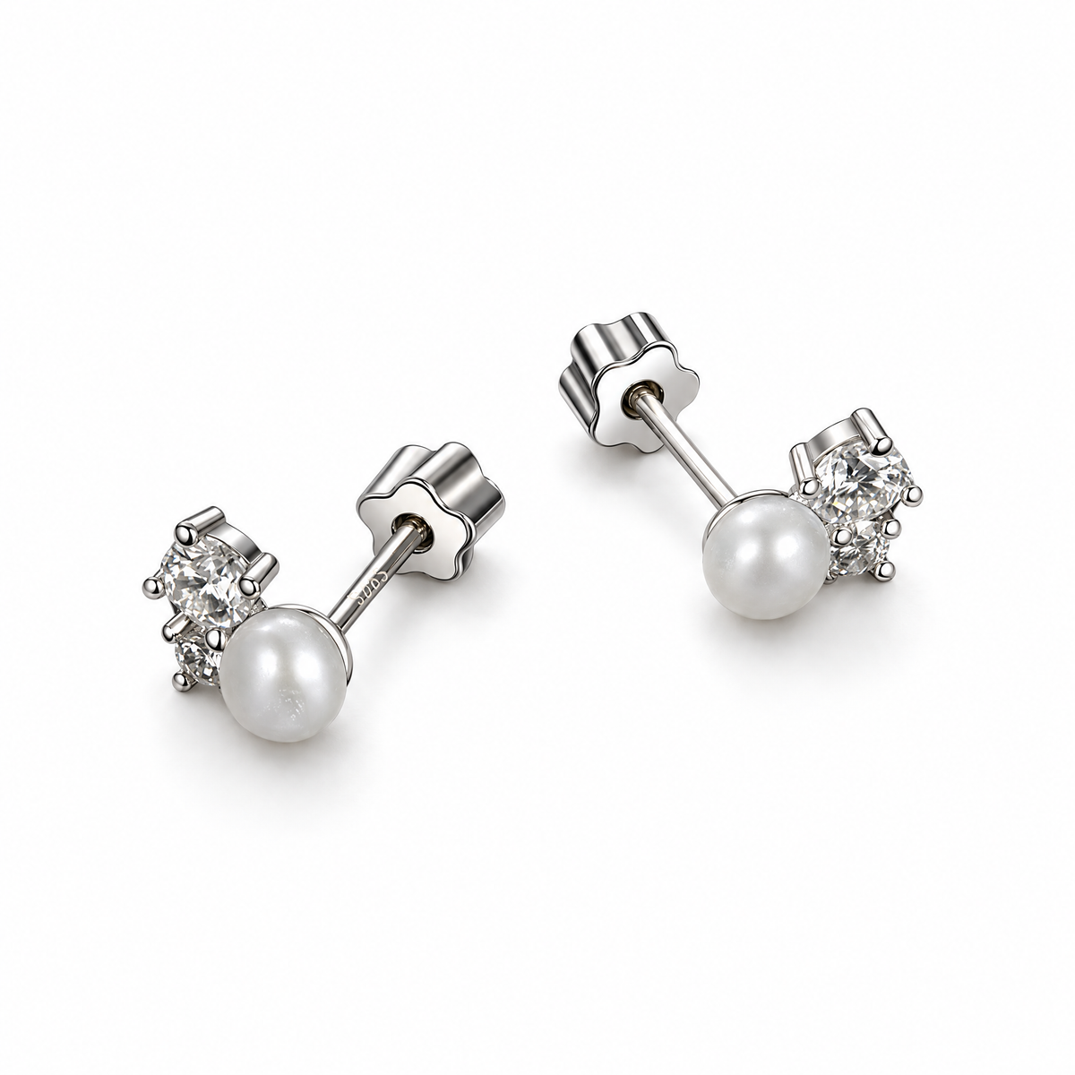 The Elva Pearl & Moissanite Stud Earrings, rear pair view with white pearls, clear round stones, straight posts and scalloped silvery butterfly backs on pale greige, reference-based AI visualization.