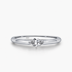 The Aure Marquise-Cut CZ Ring, polished silver marquise setting and tapered-shoulder detail on a pearl-white studio background — reference-based AI visualization.