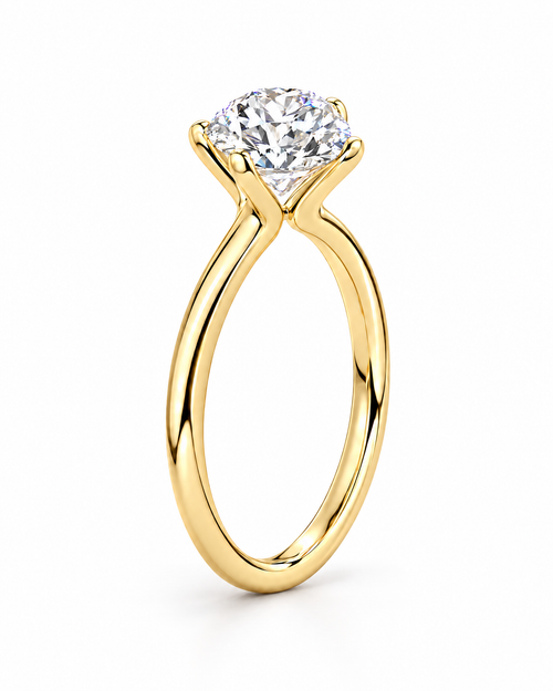 The Astrea Moissanite Solitaire Ring — warm gold-color product-only front solitaire hero on a pearl-white studio background; reference-based AI visualization.