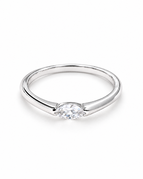 The Aure Marquise-Cut CZ Ring, polished silver front three-quarter product-only hero on a pearl-white studio background — reference-based AI visualization.