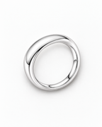 The Norden Plain Band Ring in polished silver, overhead face-up resting view on a pearl-white studio background, reference-based AI visualization.