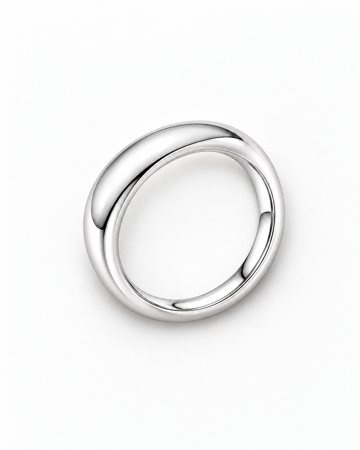The Norden Plain Band Ring in polished silver, overhead face-up resting view on a pearl-white studio background, reference-based AI visualization.