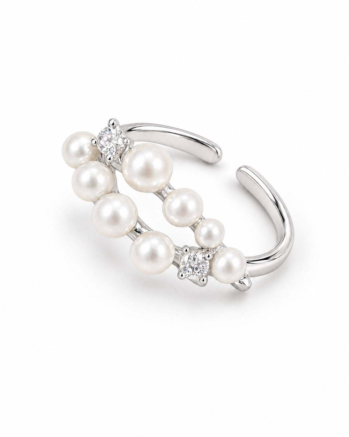 The Ilse Pearl Cluster Ring in observed silver finish, high-angle face-up full-ring studio view with ivory pearl-like cabochons and clear round faceted accents on a pearl-white background; reference-based AI visualization.