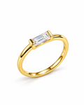 The Lyra CZ Emerald-Cut Statement Ring — gold-color front three-quarter product-only hero with a clear emerald-cut center stone on a pearl-white studio background; reference-based AI visualization.
