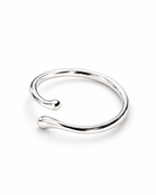 The Nova Open Geometric Band — polished silver-tone elevated three-quarter product view on a pearl-white studio background; reference-based AI visualization.