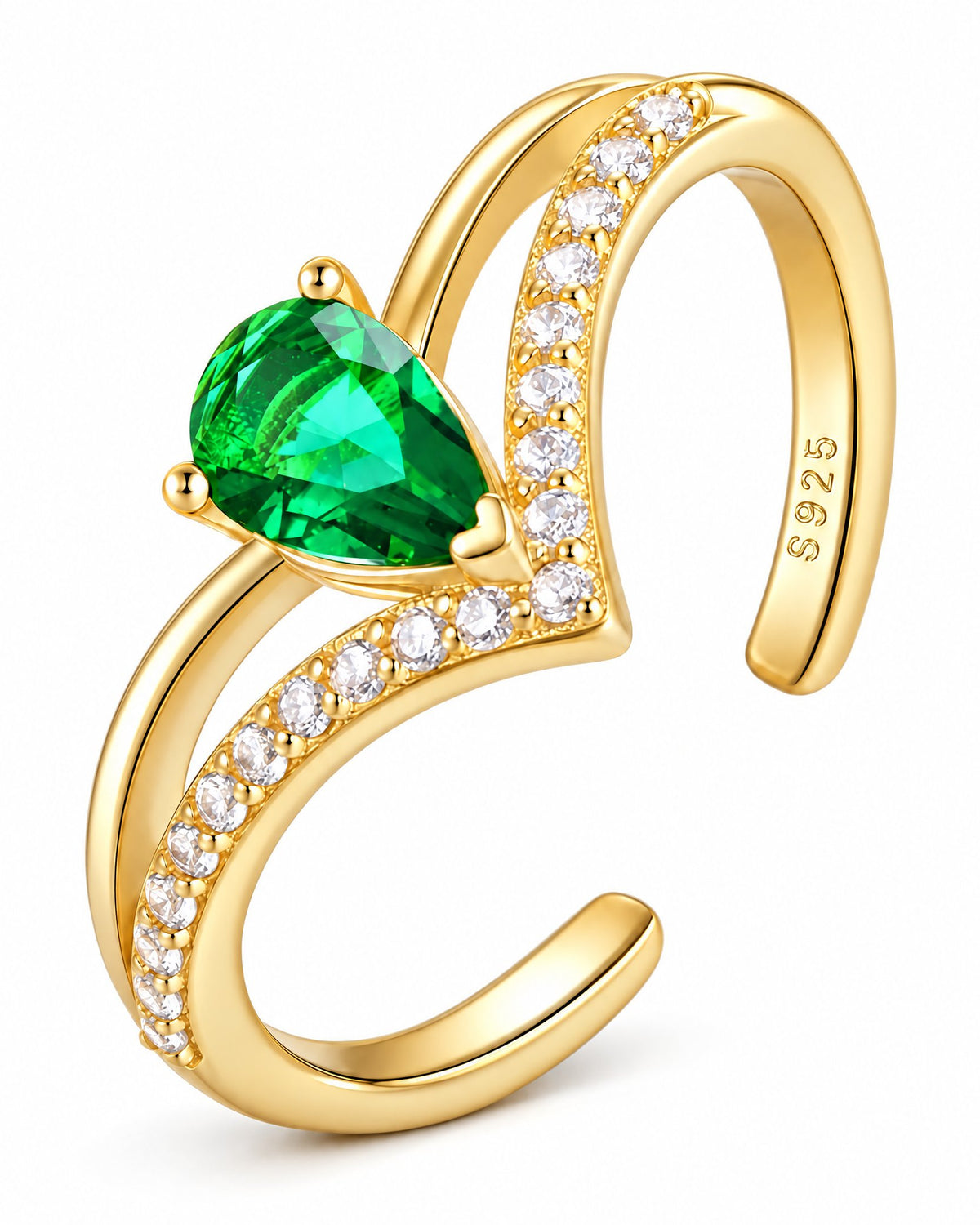 The Tuva Green Pear Wrap Ring in an oblique polished gold-color setting view with a green pear-shaped stone and clear round accents on a pearl-white studio background, reference-based AI visualization