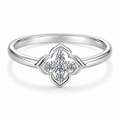 The Seren Quatrefoil Moissanite Ring in visible silver-tone finish, complete front three-quarter product-only studio view on a pearl-white background, reference-based AI visualization.