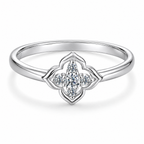 The Seren Quatrefoil Moissanite Ring in visible silver-tone finish, complete front three-quarter product-only studio view on a pearl-white background, reference-based AI visualization.