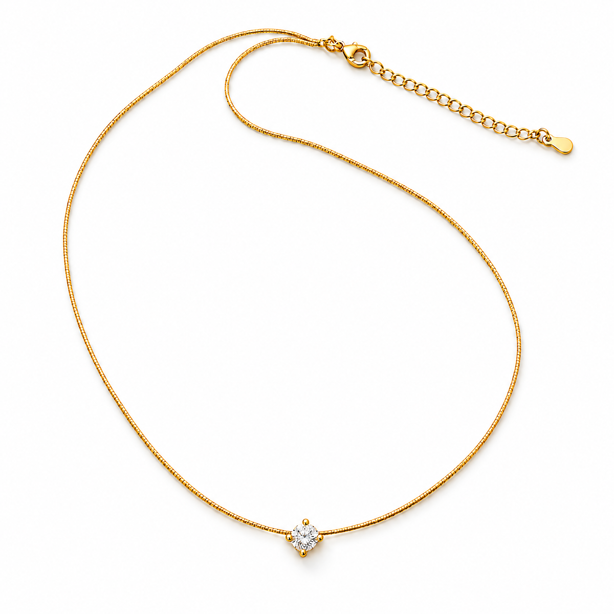 Gold-color necklace in a wide resting oval with a clear round stone in four rounded prongs and the lobster clasp, extension links, and end tag visible on pale warm greige; reference-based AI visualization.