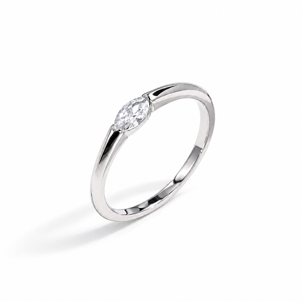 The Aure Marquise-Cut CZ Ring, polished silver angled setting-profile view on a pearl-white studio background — reference-based AI visualization.