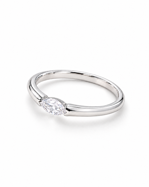 The Aure Marquise-Cut CZ Ring, polished silver angled setting-profile view on a pearl-white studio background — reference-based AI visualization.