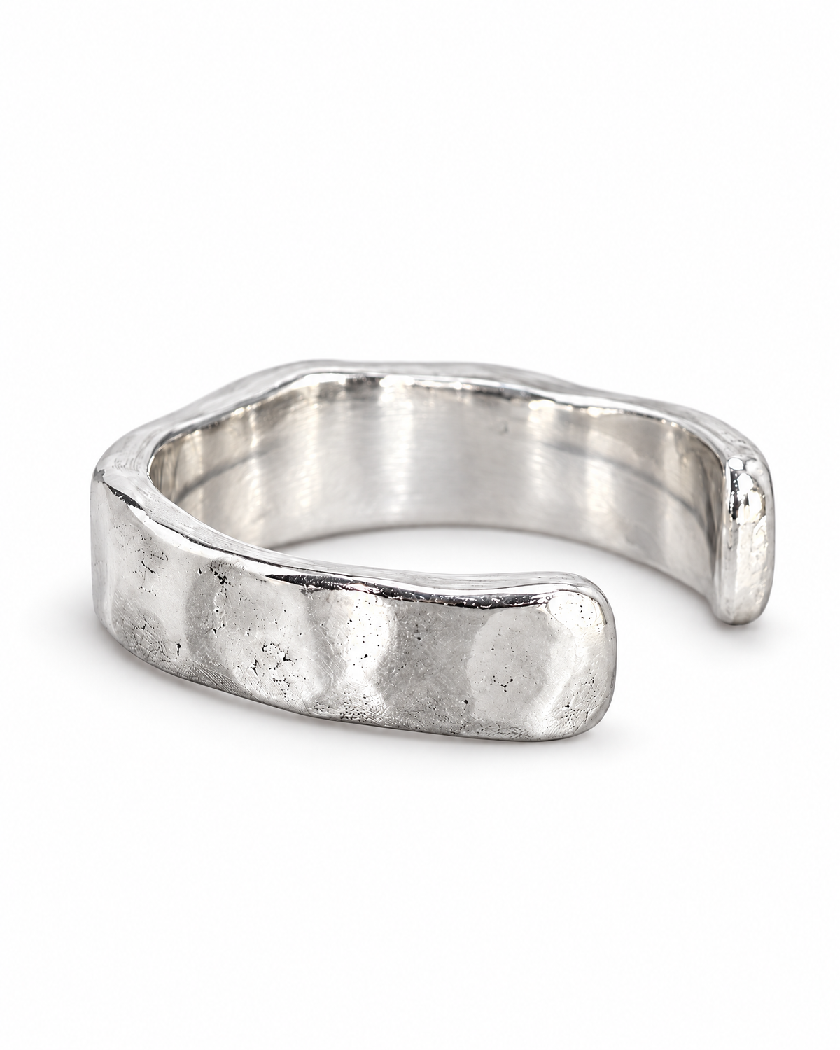 The Lena Hammered Open Band Ring — polished silver-tone left side and open-end profile on a pearl-white studio background, reference-based AI visualization.