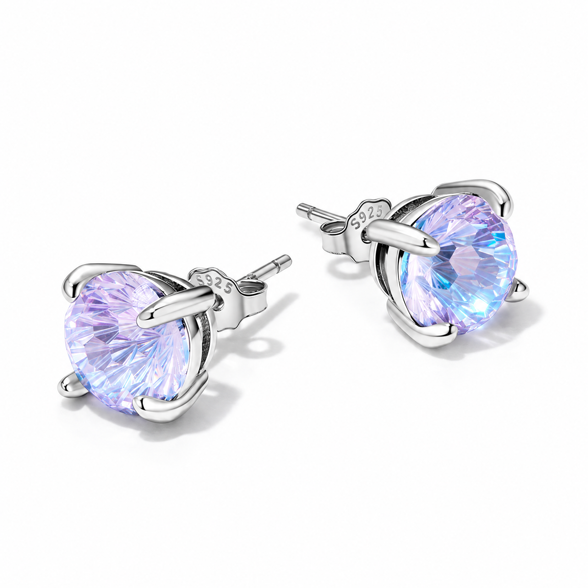 The Frida Firework CZ Stud Earrings: purple-lilac faceted four-prong stud pair with posts, scalloped butterfly backs and visible S925 marks on pale greige, reference-based AI visualization