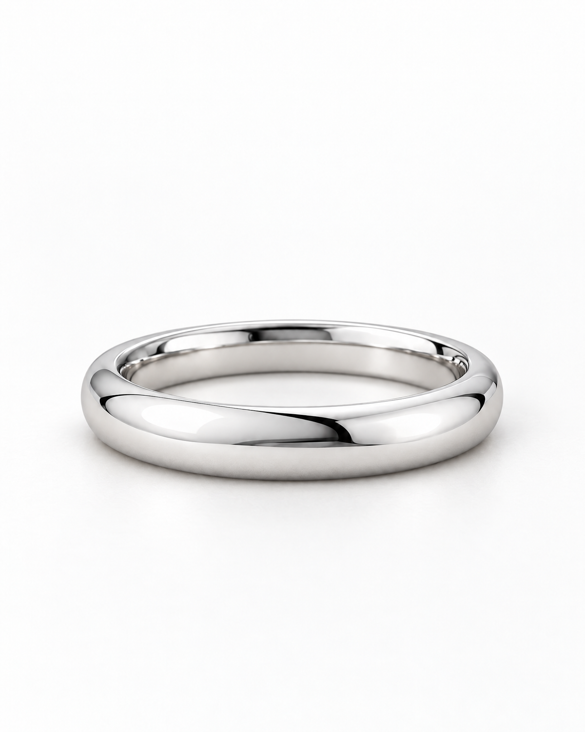 The Norden Plain Band Ring in polished silver, low side-profile resting view on a pearl-white studio background, reference-based AI visualization.