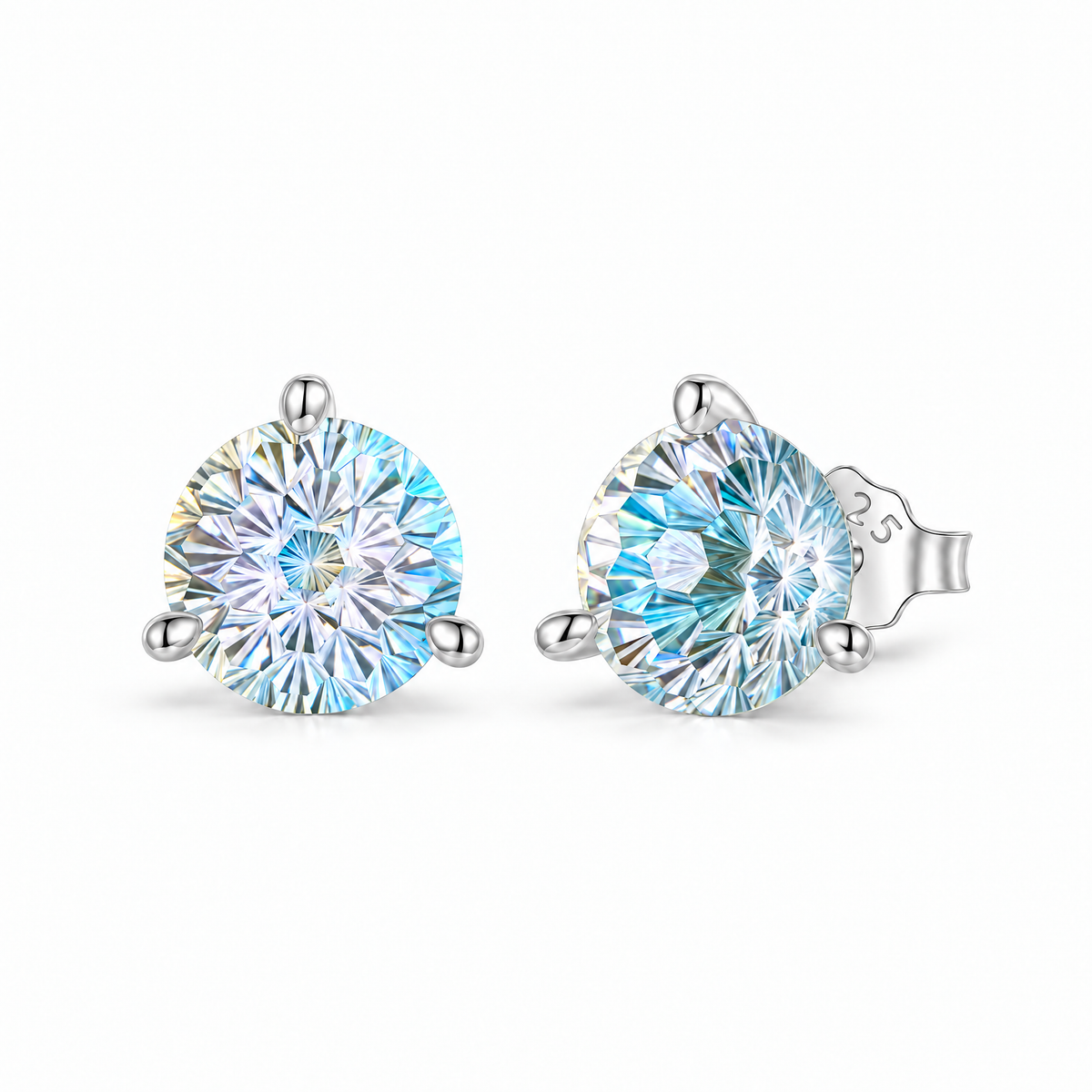 The Frida Firework CZ Stud Earrings: pale clear and aqua-blue rainbow faceted three-prong stud pair with a source-supported post and butterfly back view on pale greige, reference-based AI visualization